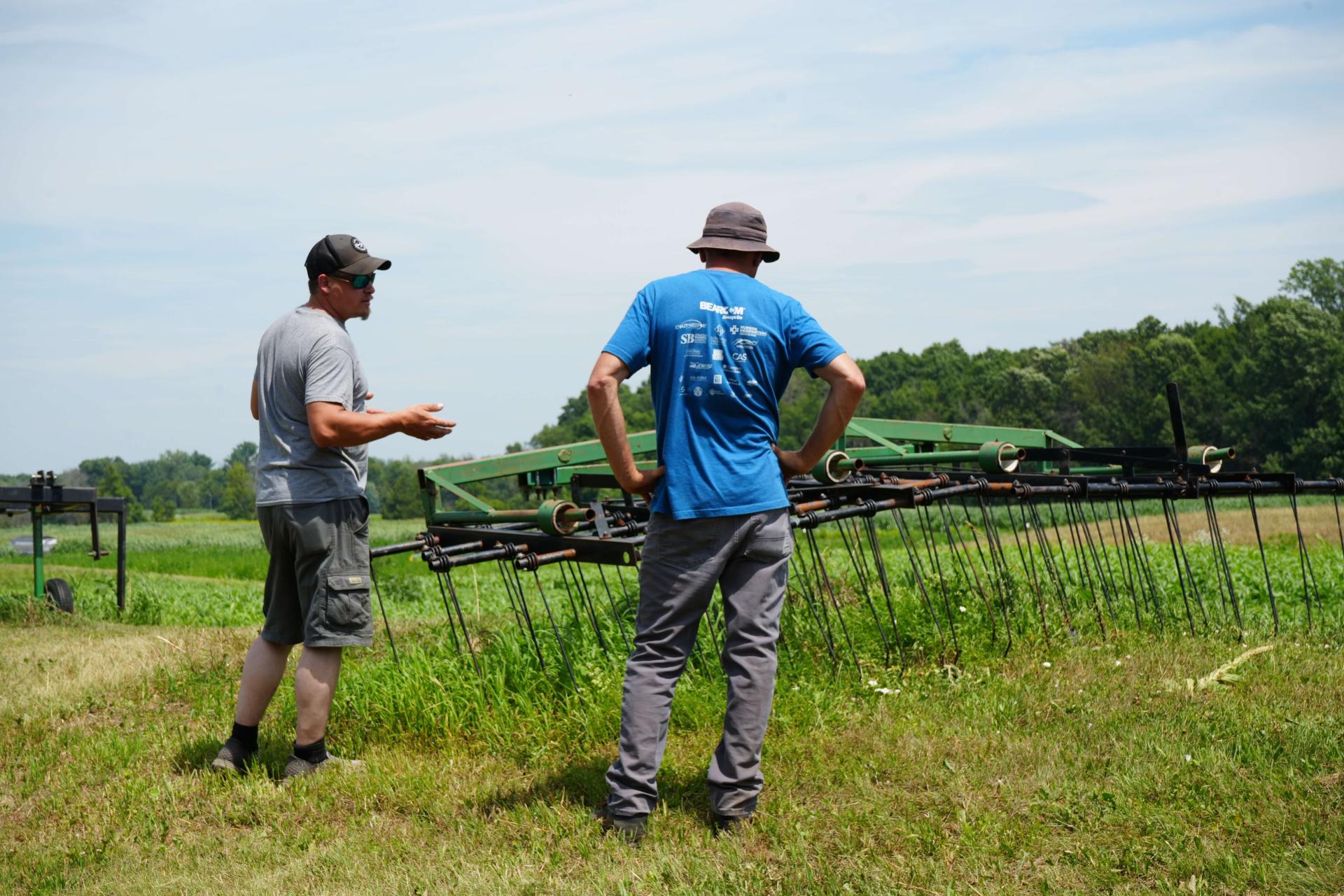 farmers looking at equipment