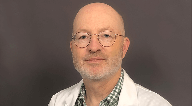 a man in a white coat