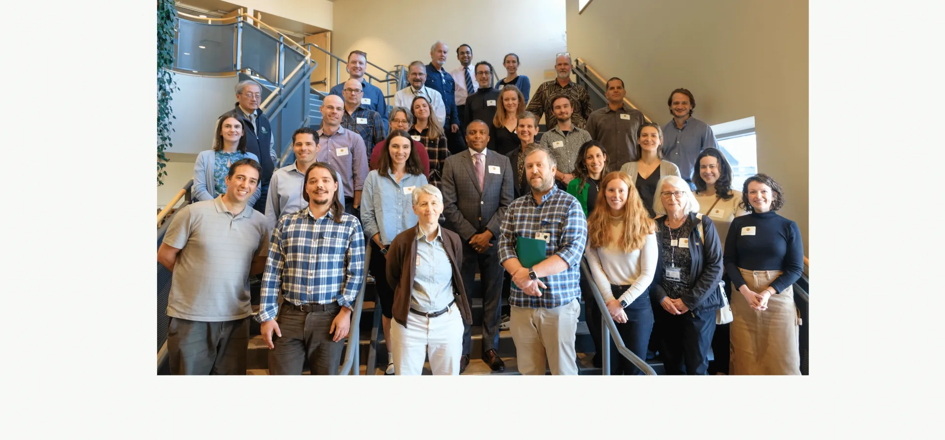 Department faculty standing on steps.