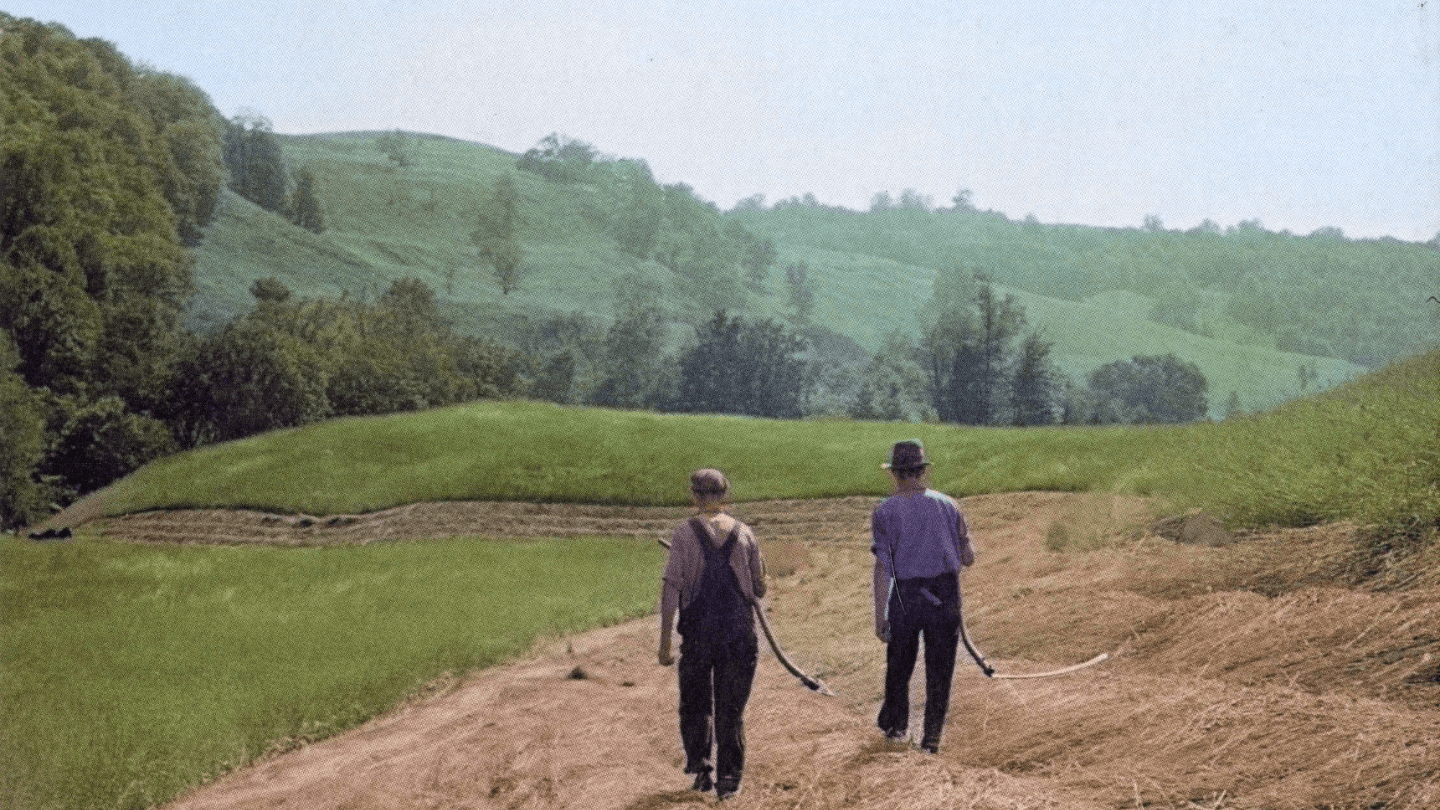 Painting of two men walking along farmland