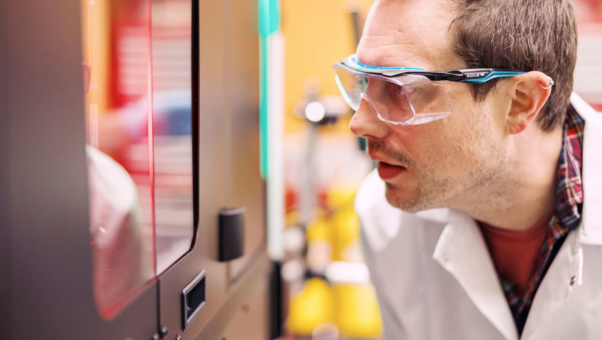 male student working in Kozen Lab
