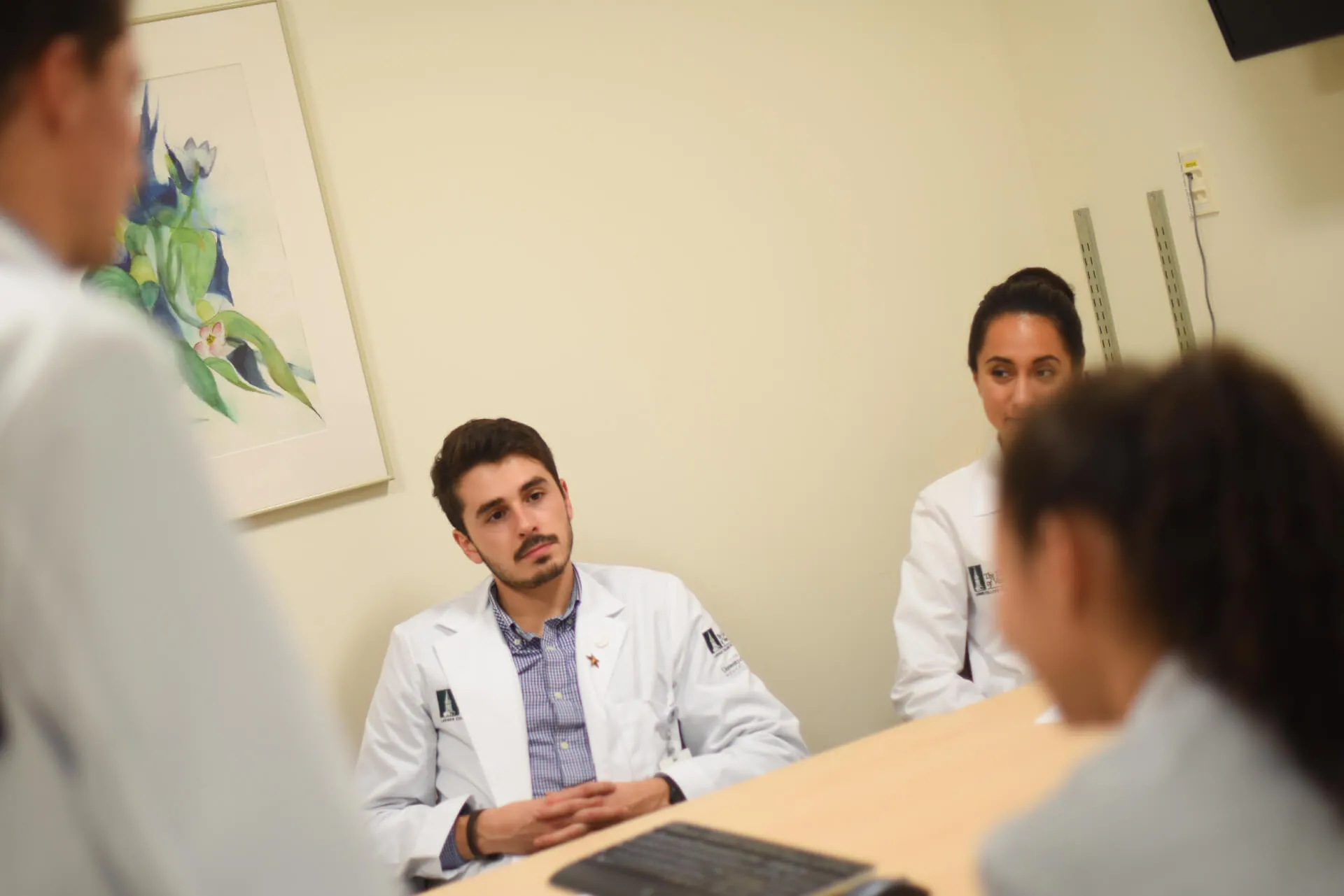 Group of clinicians around a table