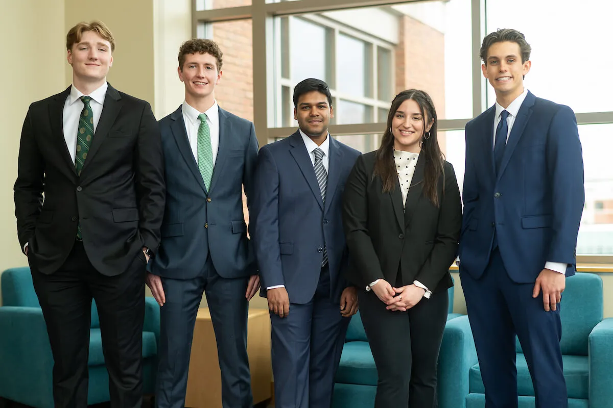 5 students wearing business attire