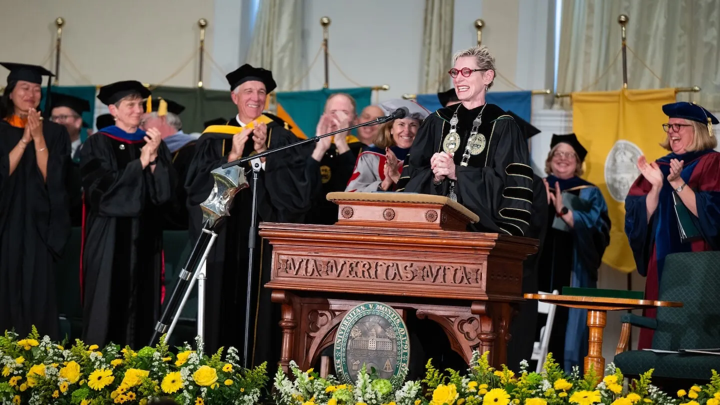 a crowd of people in academic garb on a stage