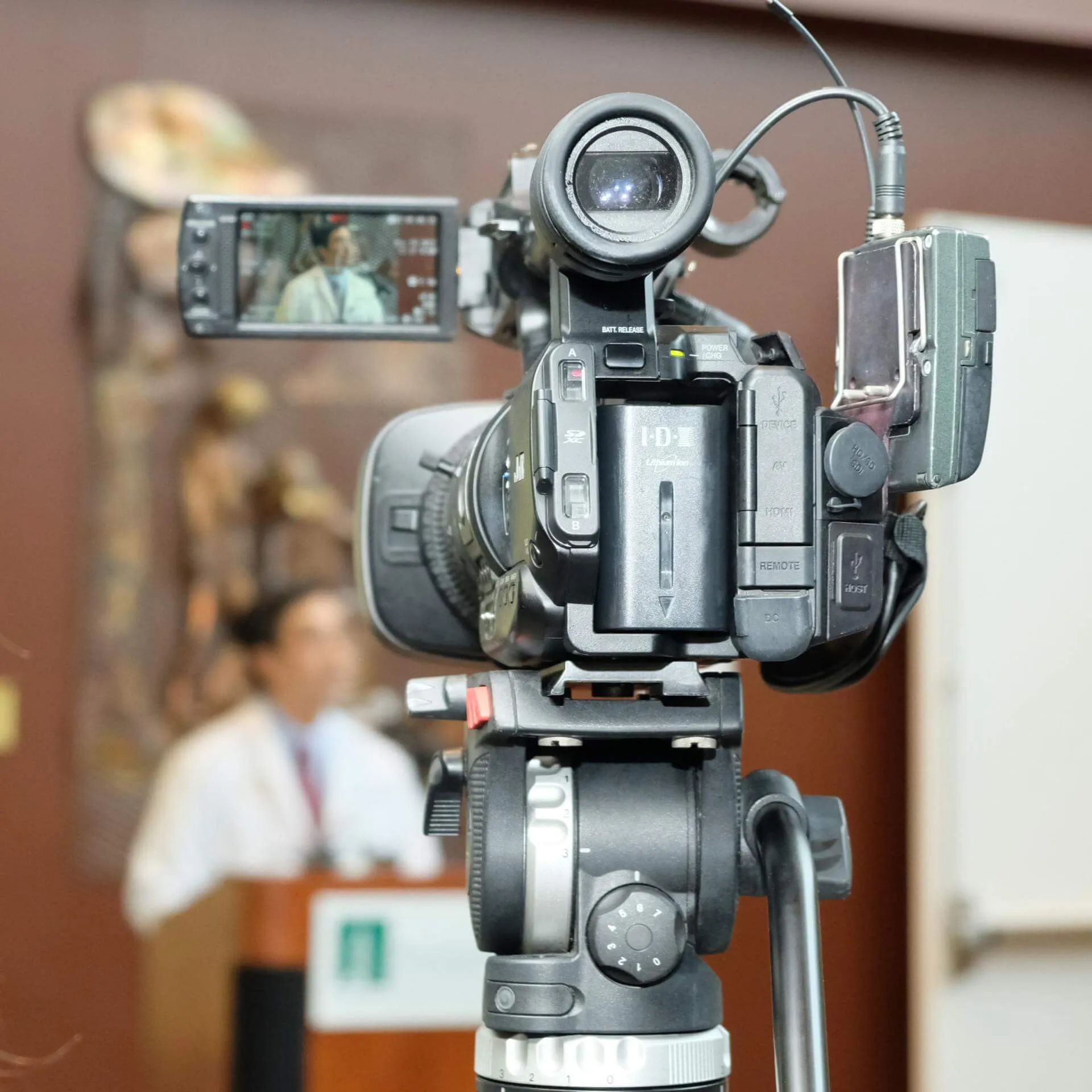 A UVM faculty expert being interviewed by journalists. 