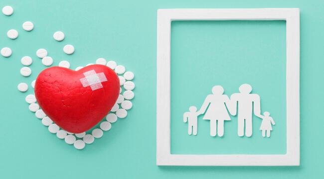 picture of heart and cutouts of people depicting a family