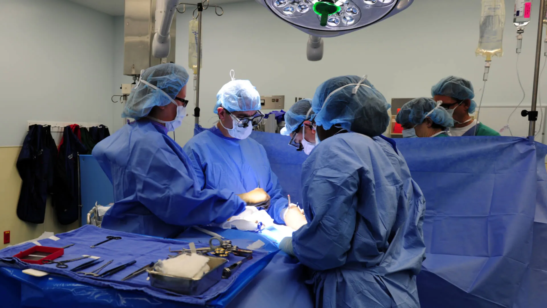 surgeons working on a patient in an operating room