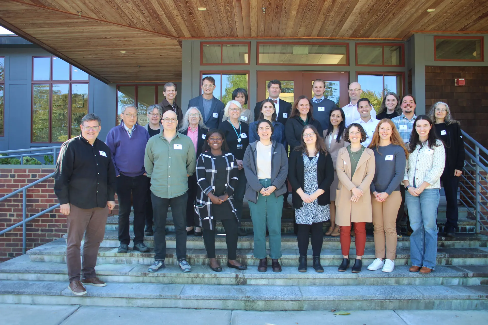 A group of faculty standing together outside