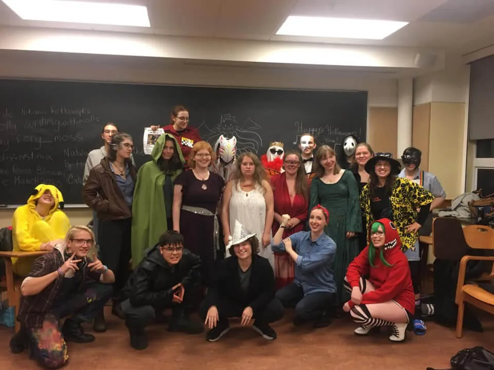 Group of students in a classroom dressed in various creative costumes