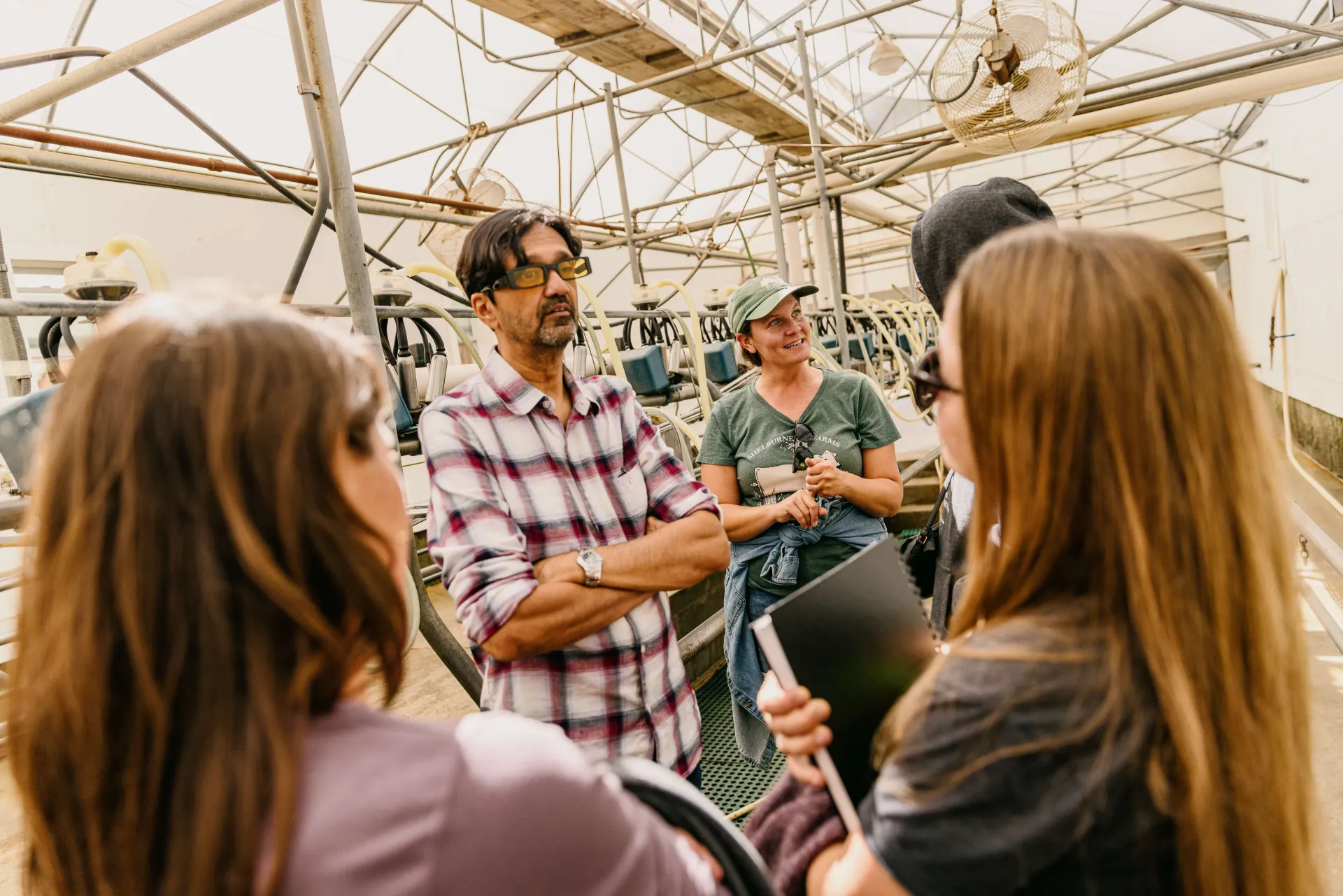 people talking in a barn