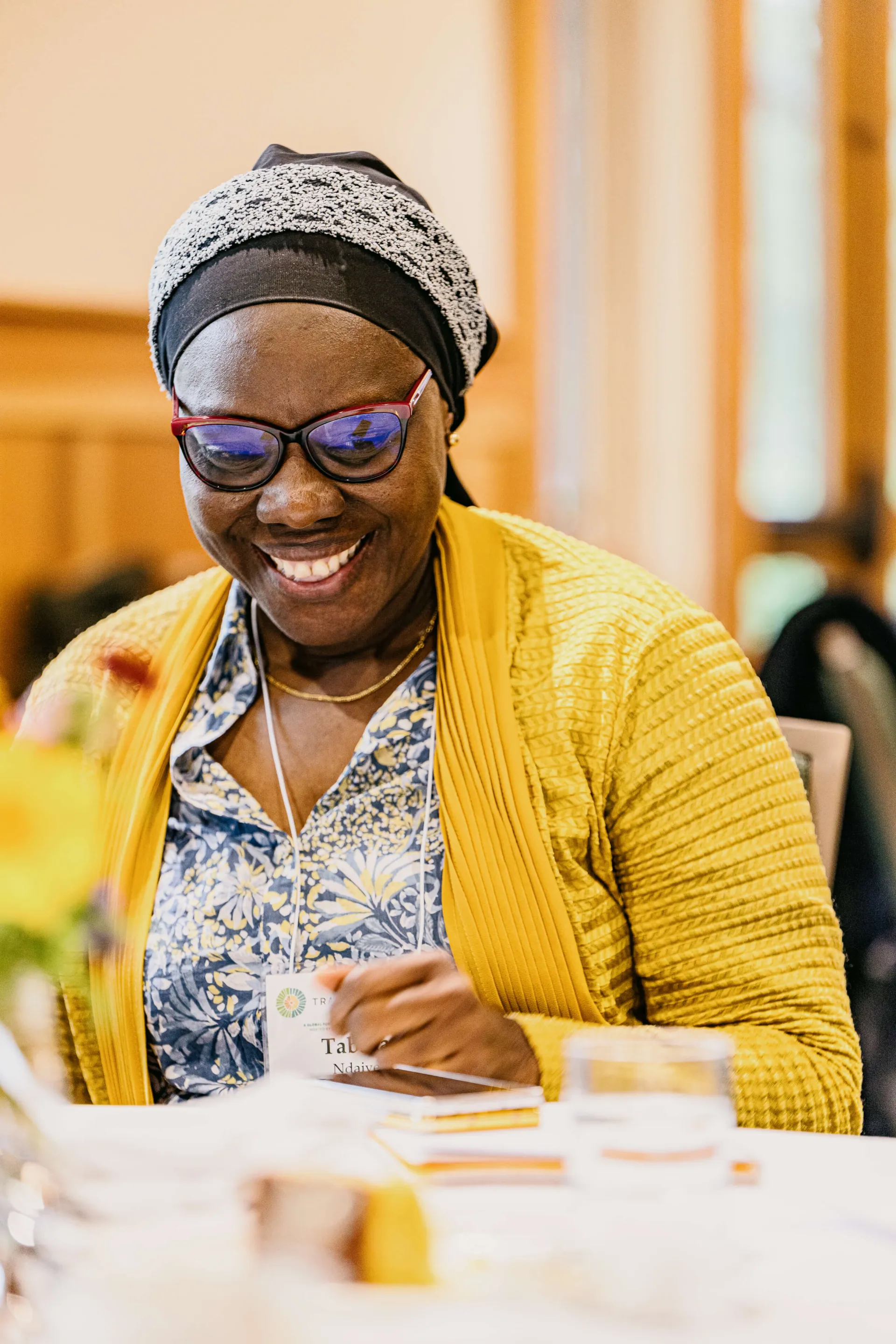 smiling woman at a table