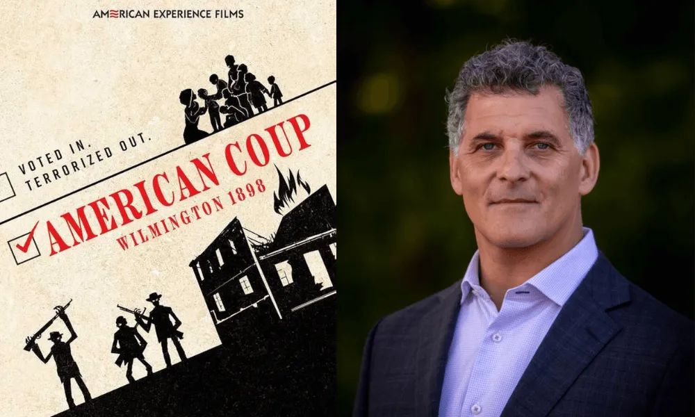 Filmmaker Brad Lichtenstein with poster for his documentary American Coup: Wilmington 1898.