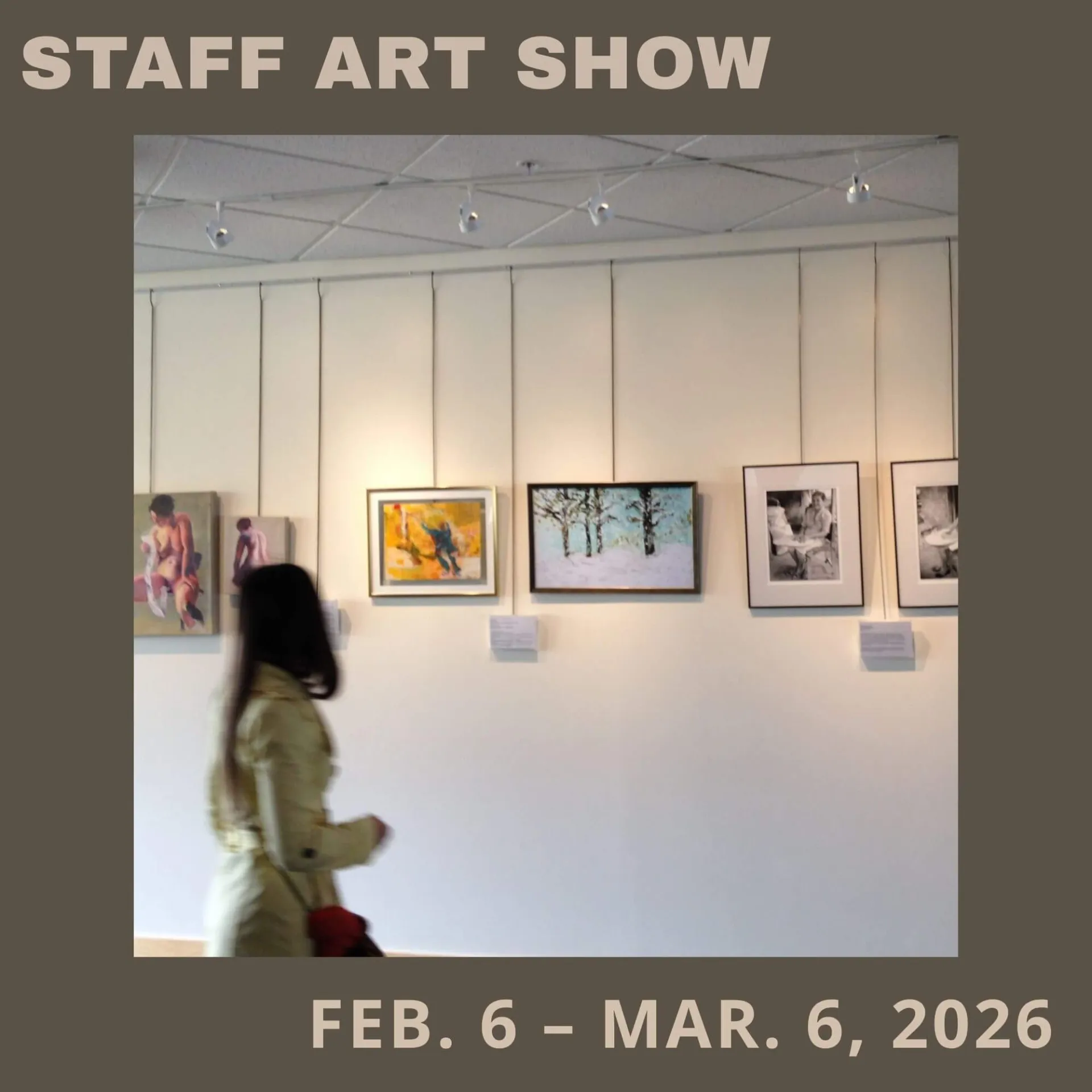 Image of woman looking at art in the fireplace lounge gallery