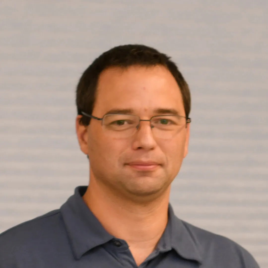 headshot of a man smiling