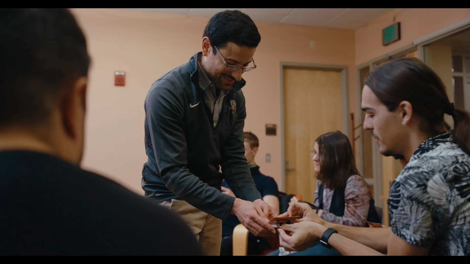 Evan and students attending the MMP