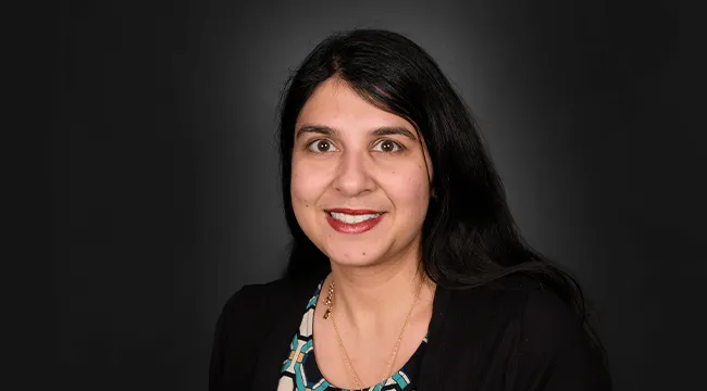 headshot of a person smiling