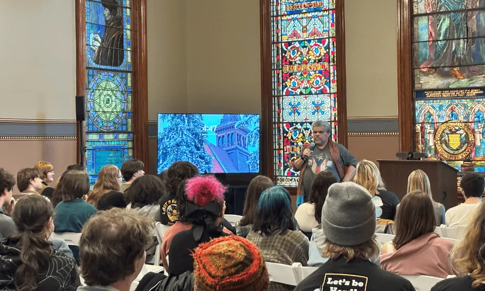 Actor Luis Guzmán speaks to a group of UVM students during a guest visit in a classroom