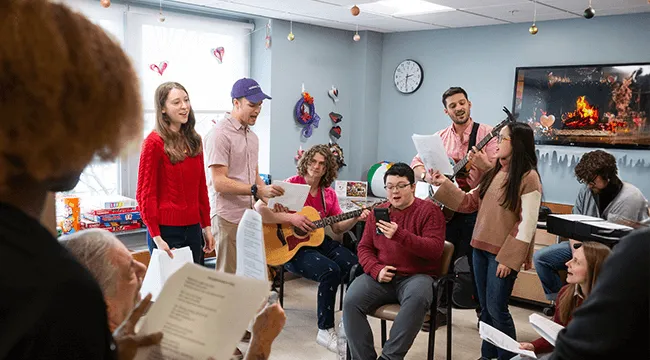 a group of people playing and singing music