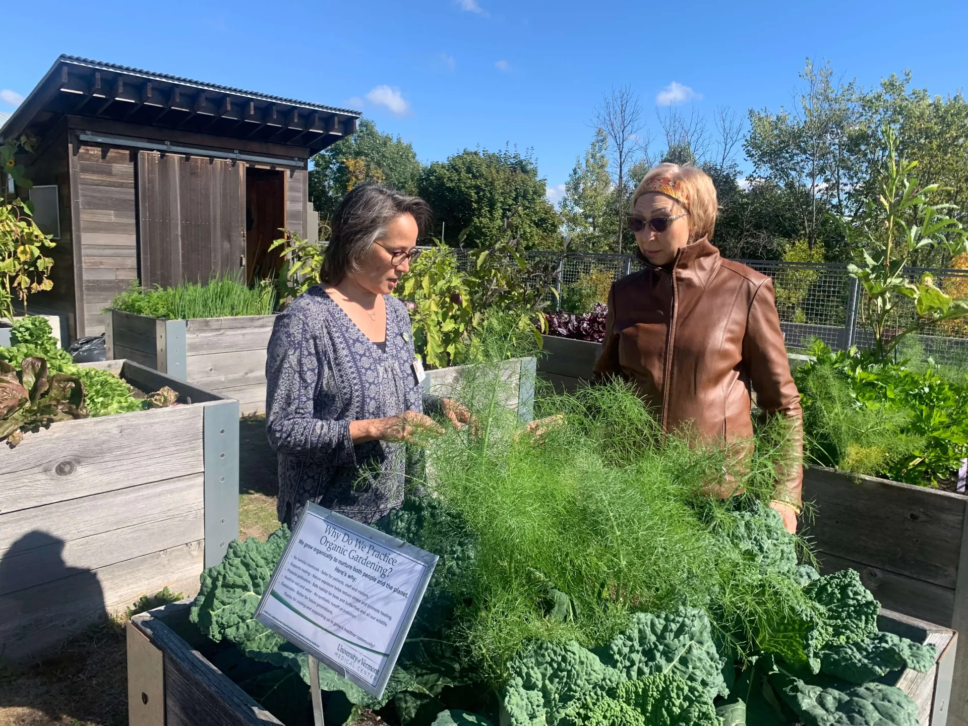 two women touring a garden