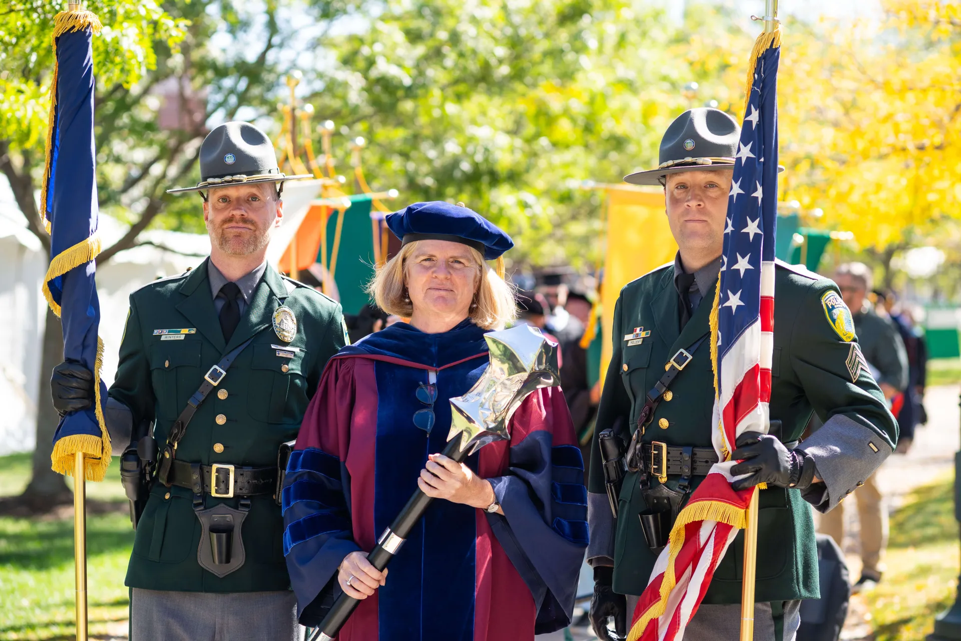 Abigail McGowan carrying the University Mace in Procession