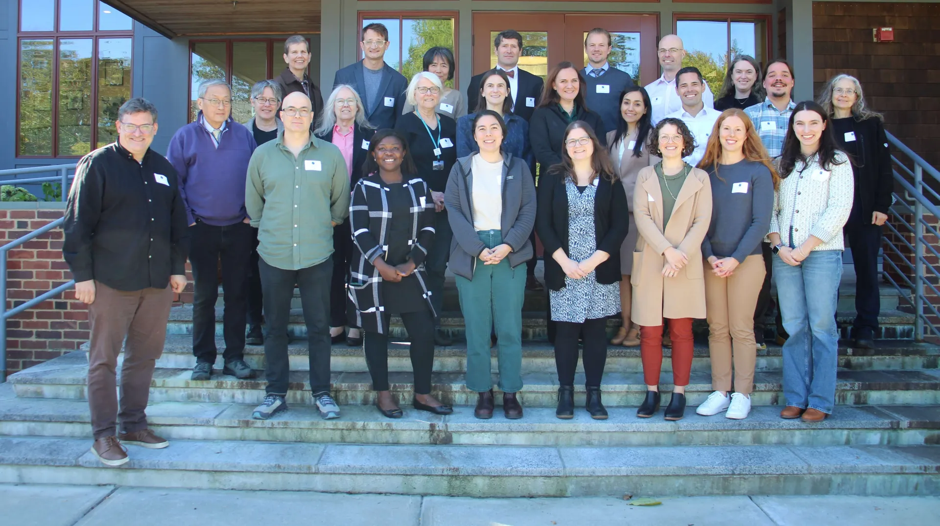 A group of faculty standing together outside