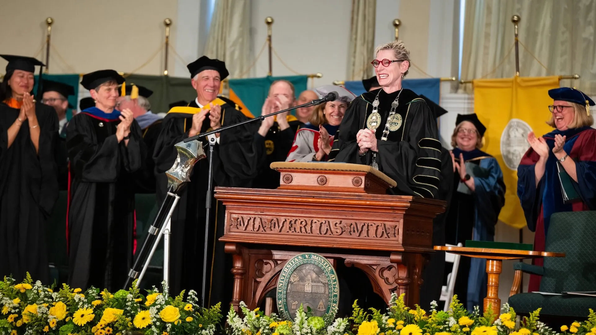 a women speaking at podium in Ira Allen Chapel