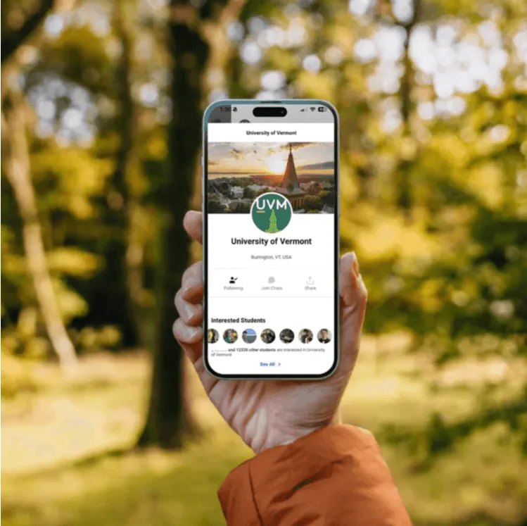 Hand holding a phone showing the ZeeMee app