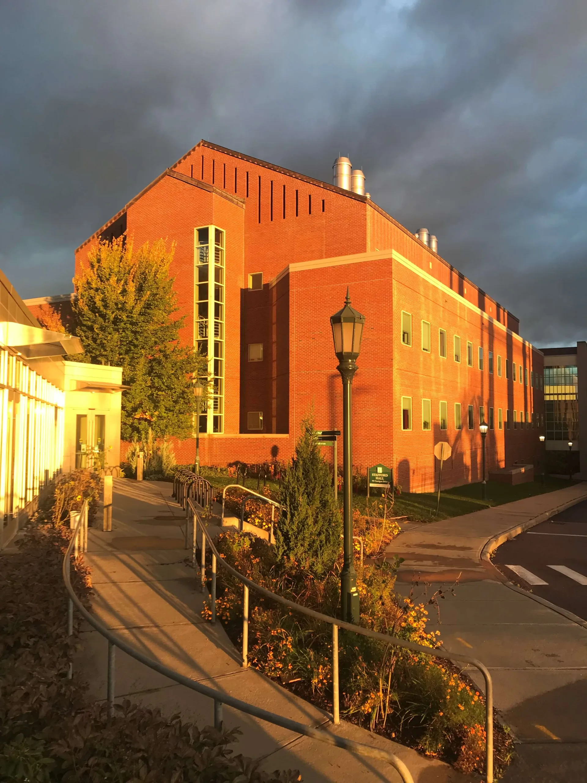 Stafford Hall on a cloudy day at sunset
