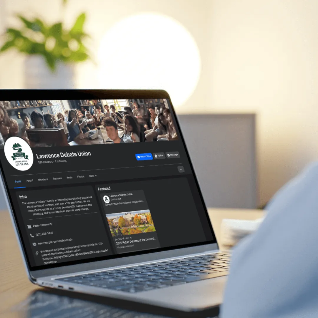 Person viewing the Lawrence Debate Union’s Facebook page on a laptop