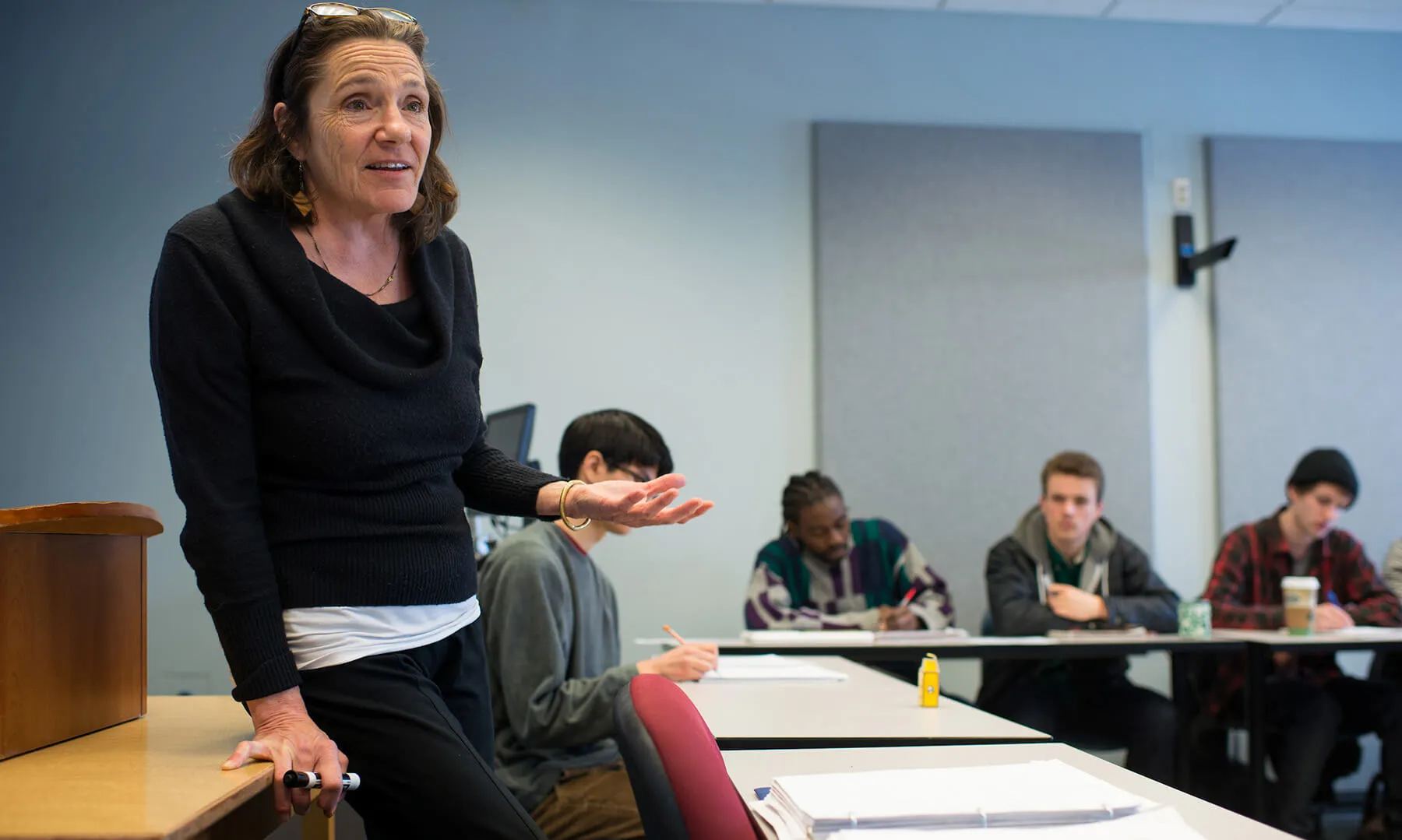 Instructor speaking to students in a classroom at the University of Vermont.