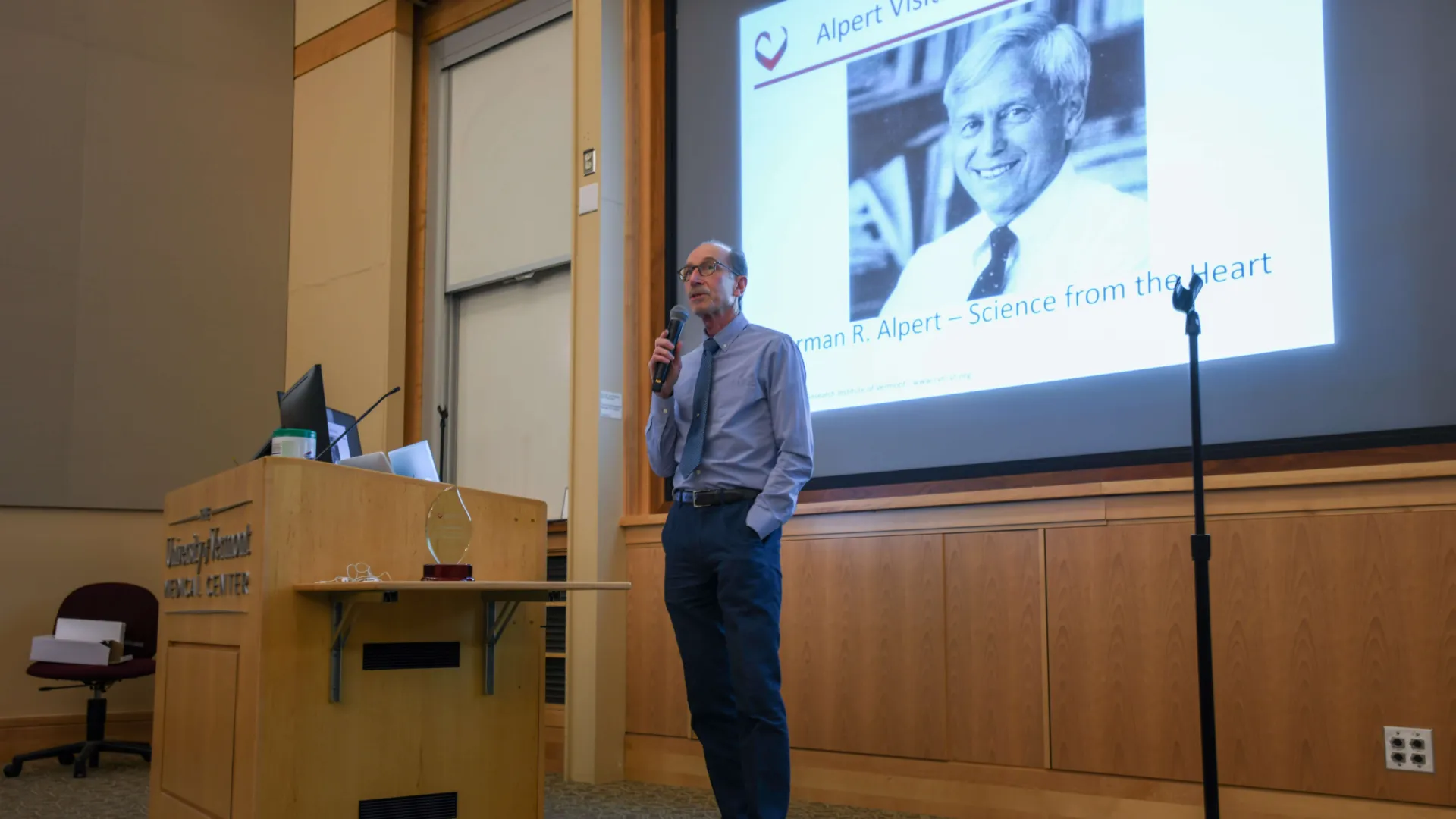 man standing in front of presentation screen