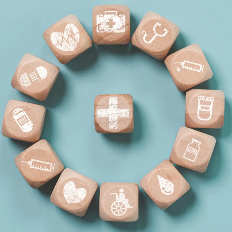 wooden blocks with public health symbols