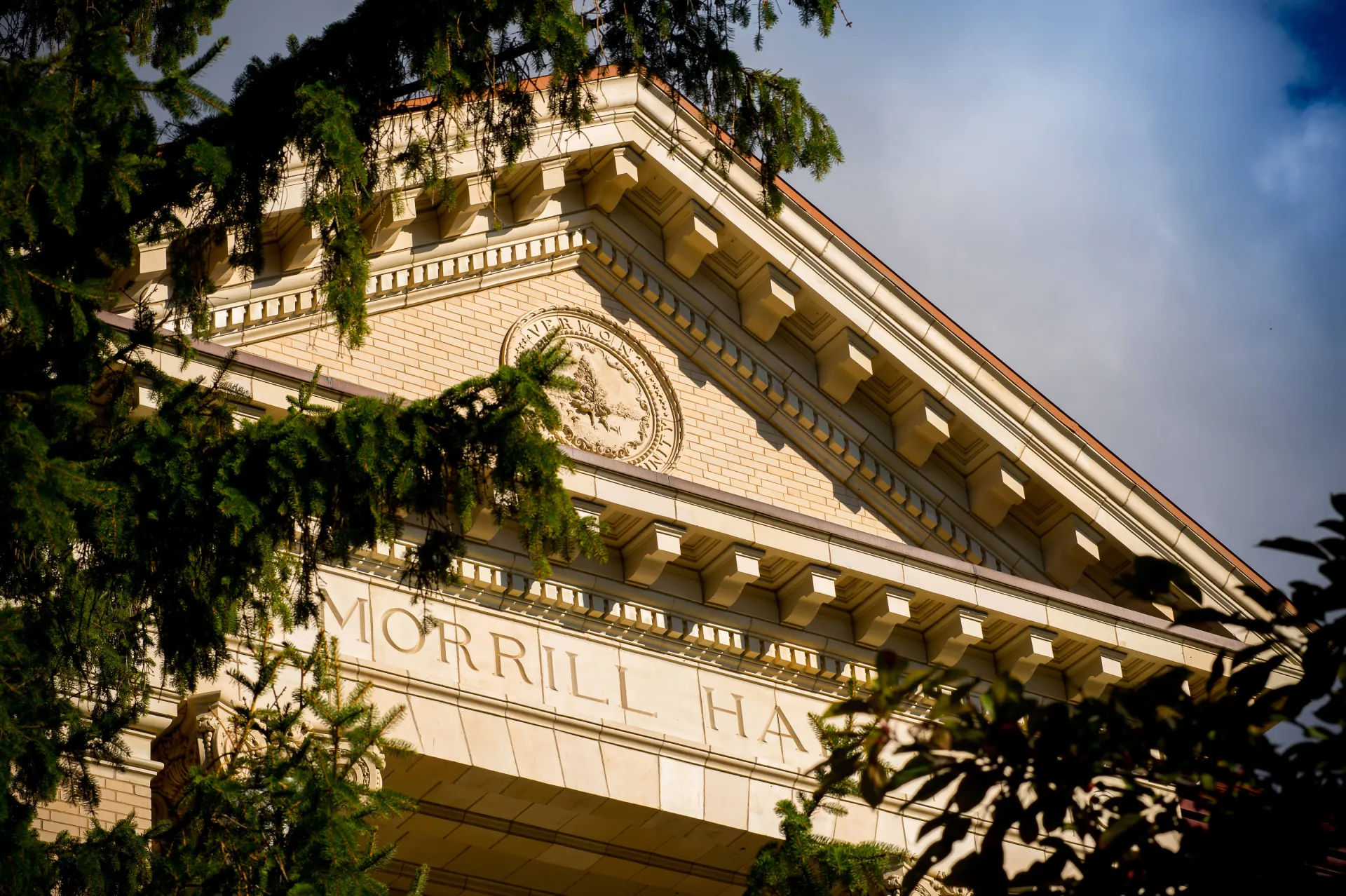 morrill hall on uvm campus, trees in the foreground