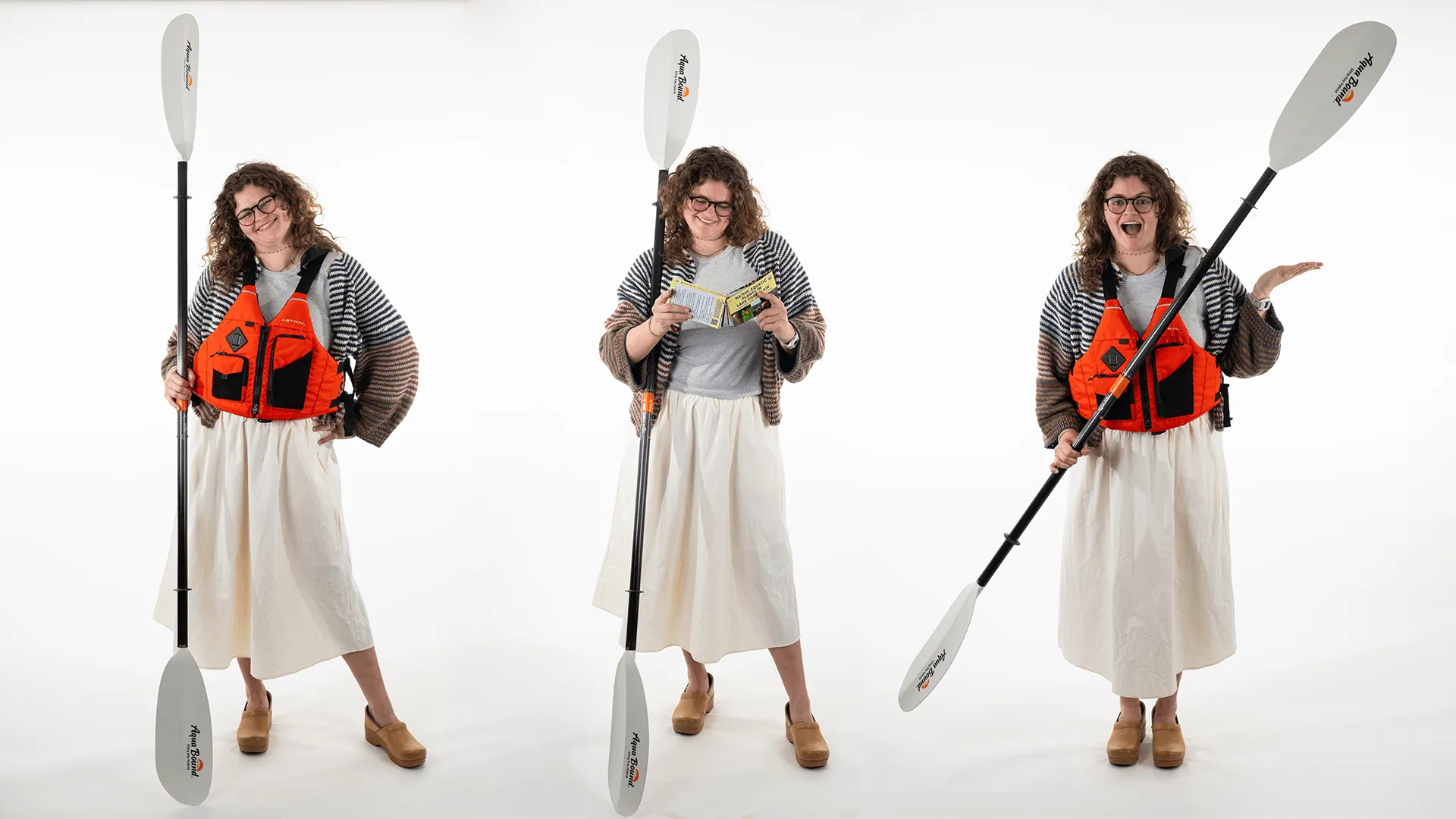 three individuals holding a life preserver and kayak paddle in different poses