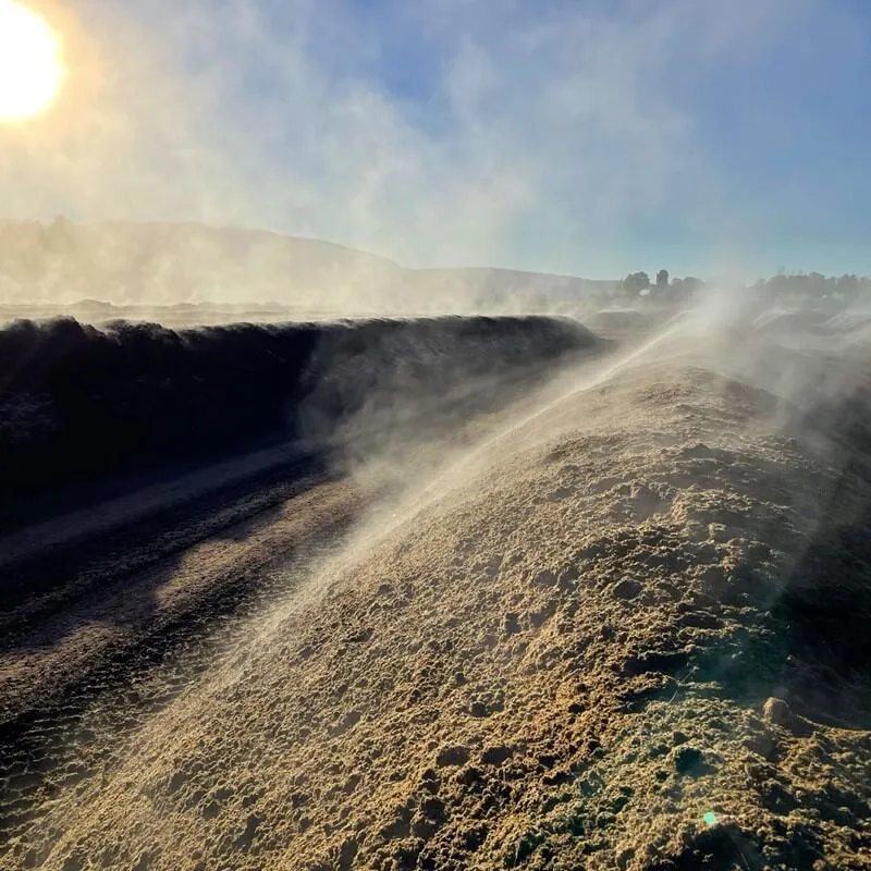 Pile of dirt or compost that is steaming 