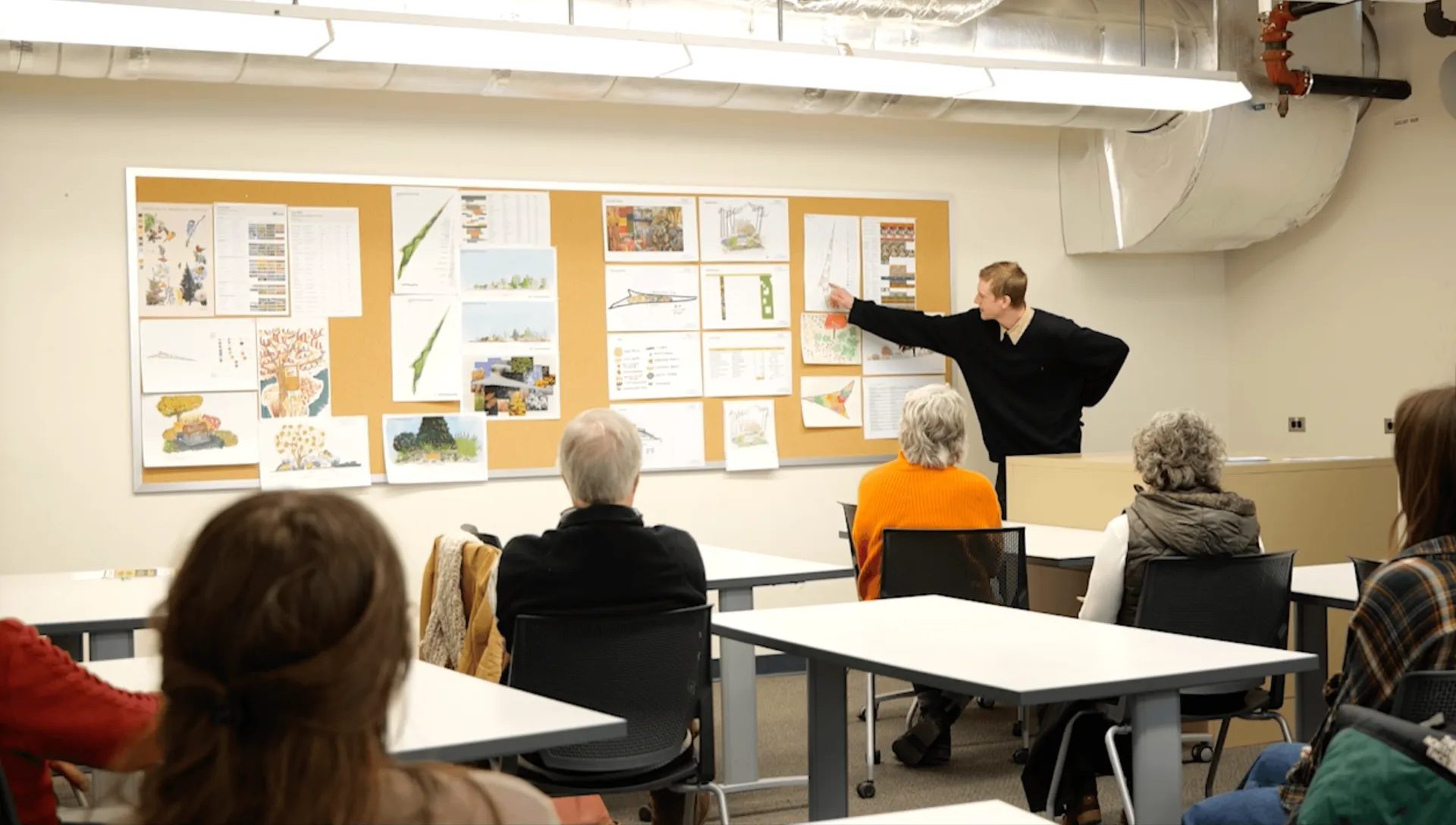 student showing design work