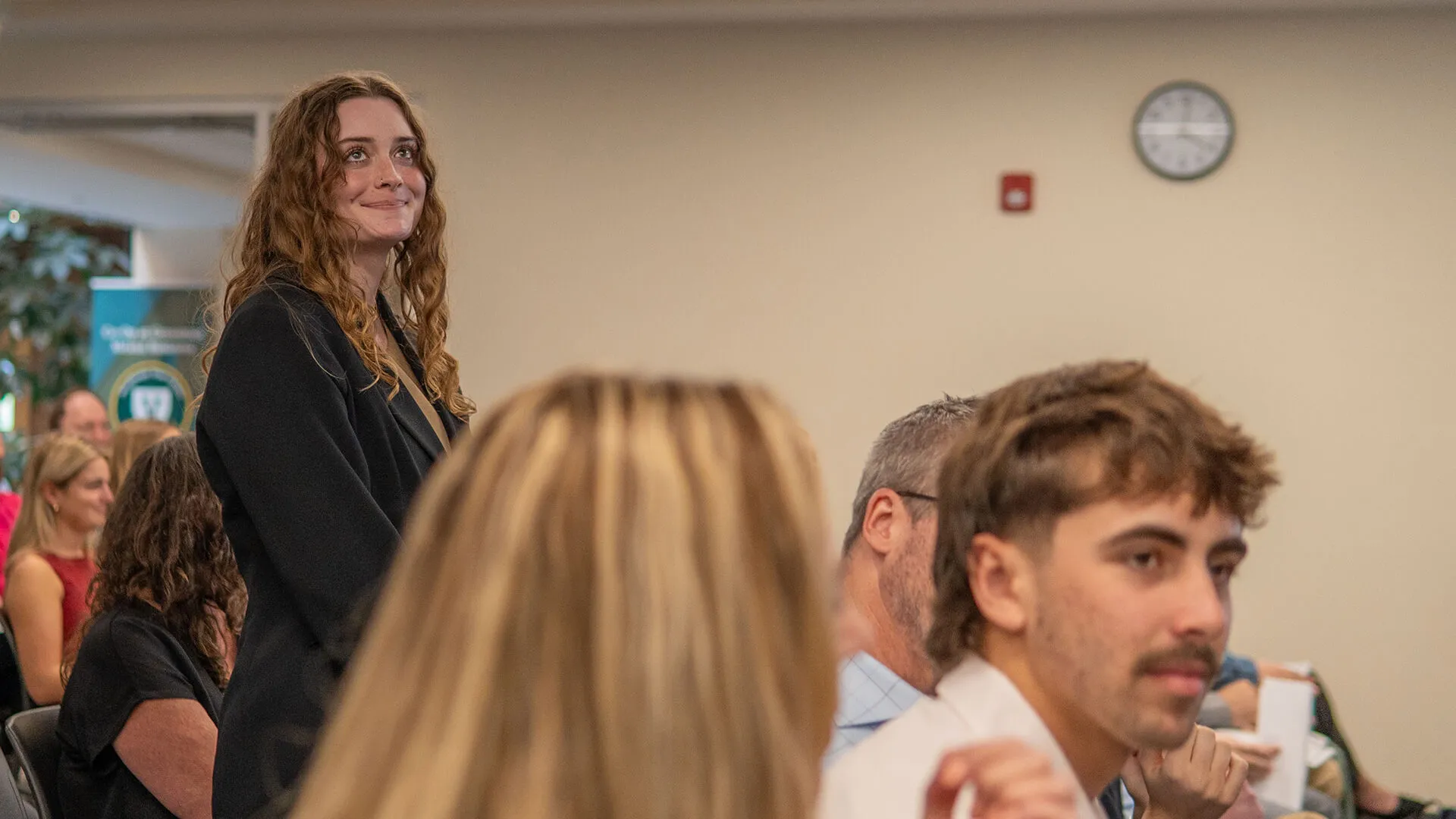 a young woman stands after being recognized at the 2026 Honors Awards Ceremony