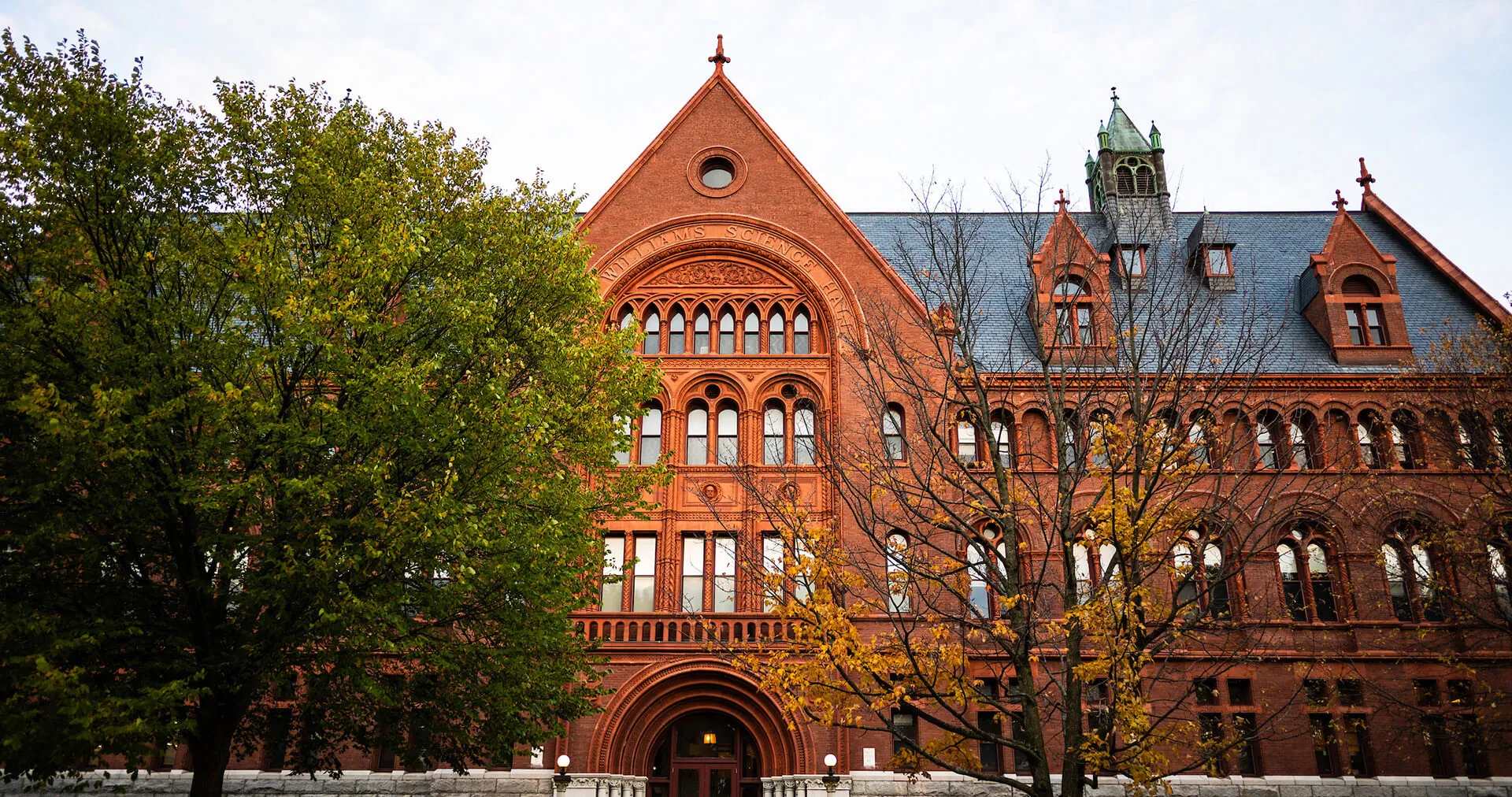 Historic university building with fall foliage