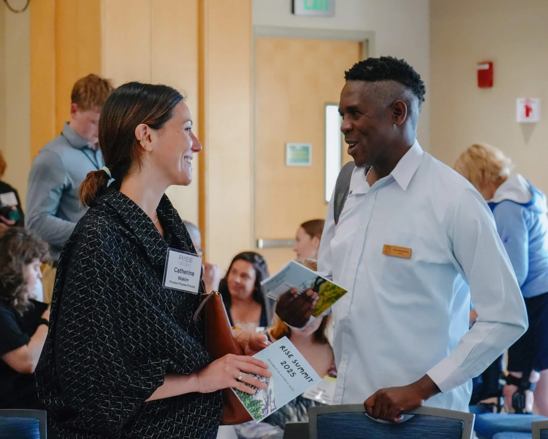 People conversing at the 2025 RISE Summit