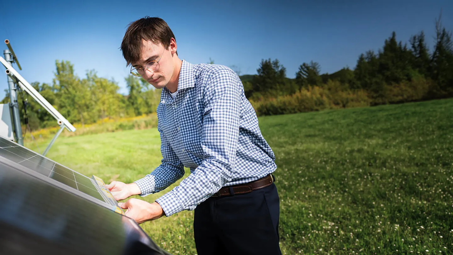 a student measures a solar panel