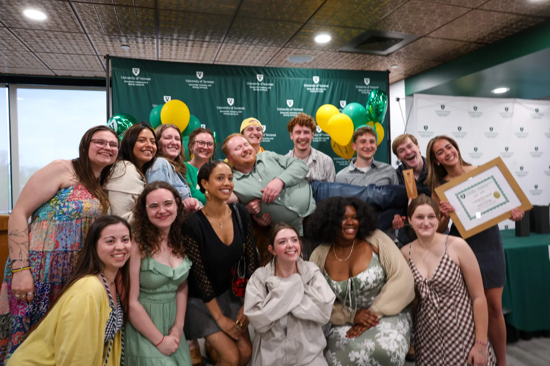 a large group of people pose together
