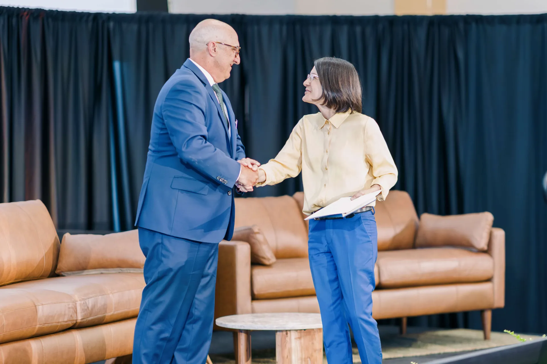 Becca Balint and Kirk Dombrowski shaking hands