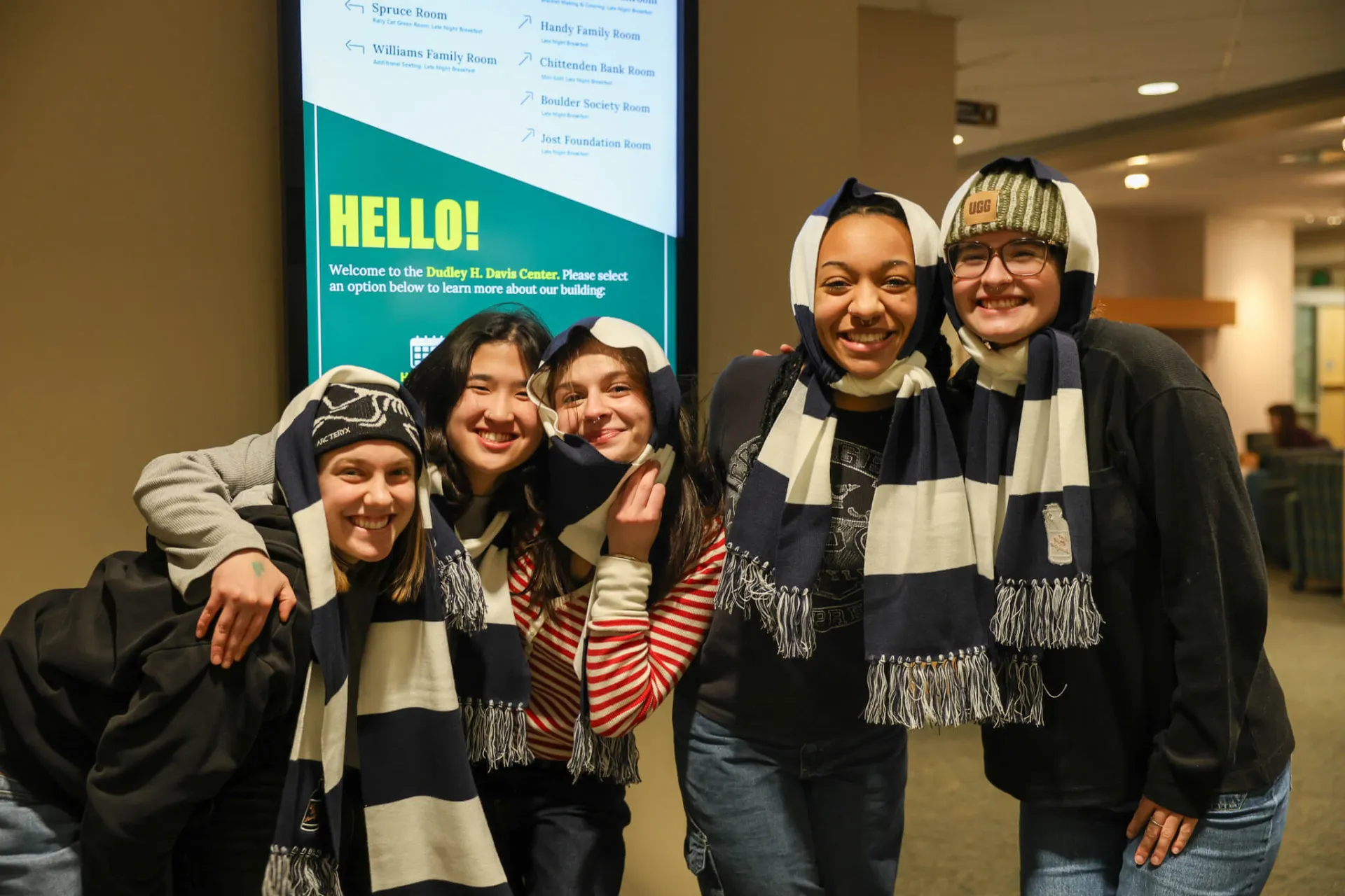 group of students wearing scarfs indoors