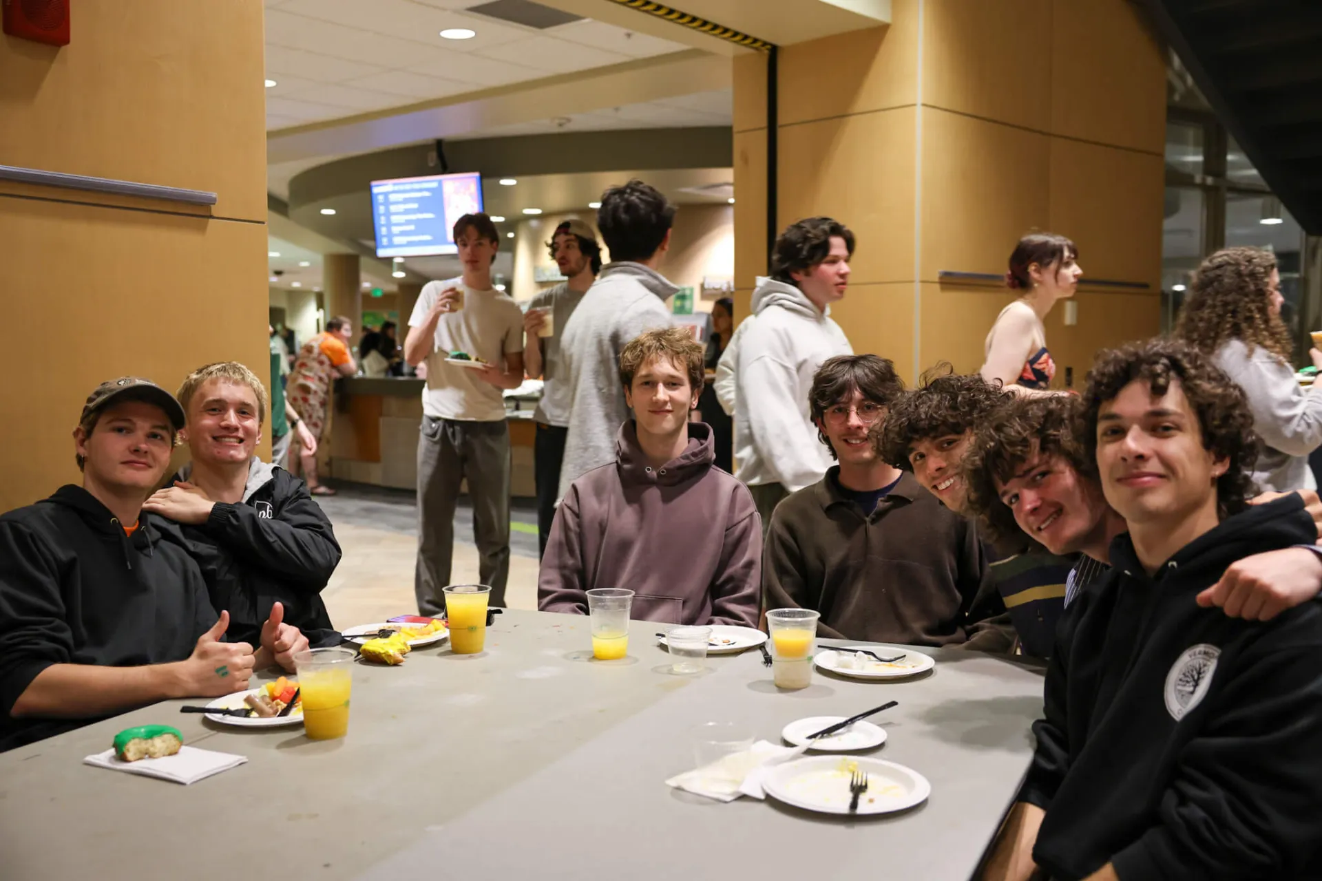 group of students enjoying late night breakfast 