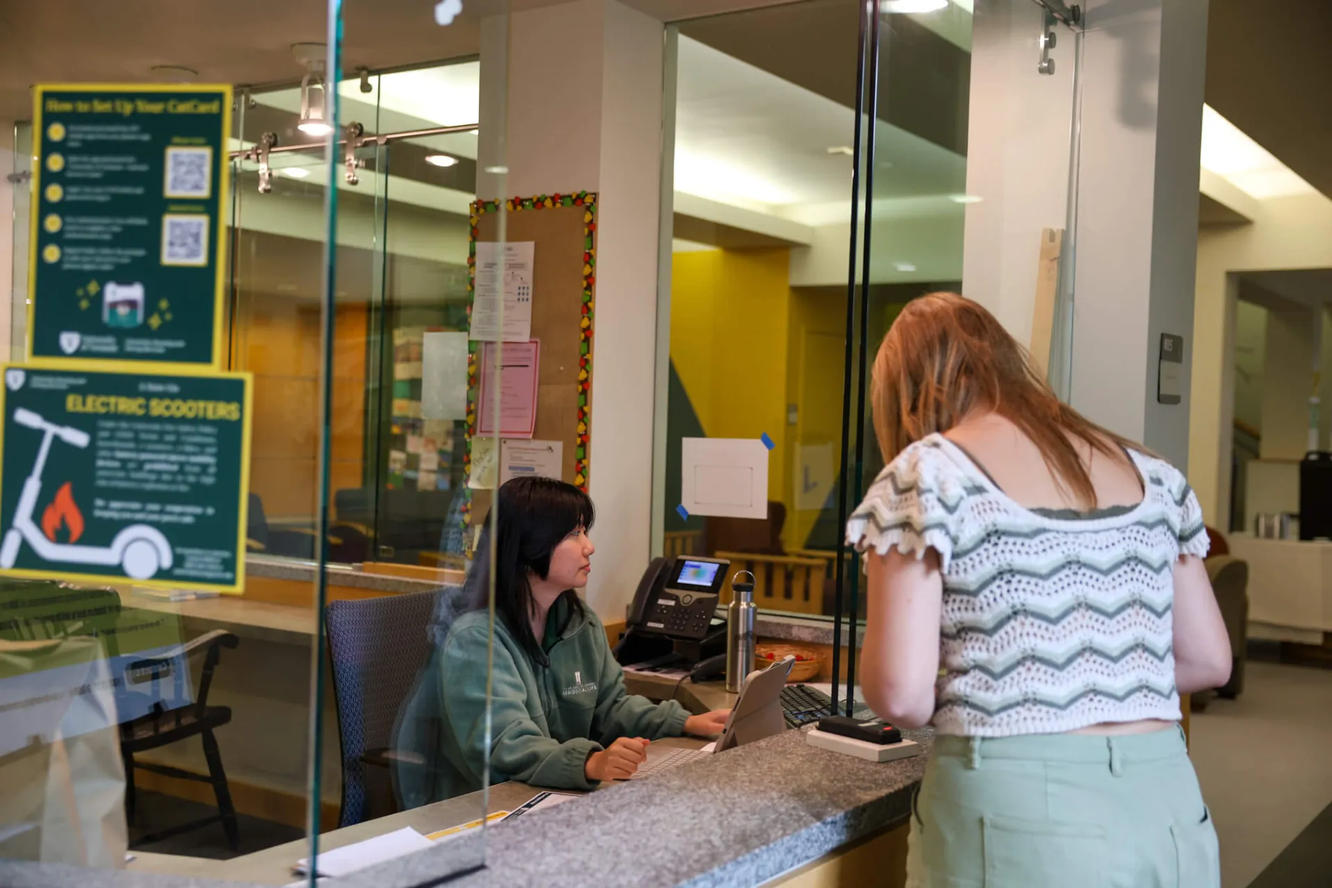 Student Worker checking in Resident