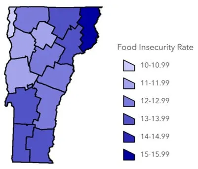 A map of the state of the Vermont with counties color coded in a gradient by food insecurity rate. The Northeast Kingdom and southern Vermont have higher rates than northwest and central Vermont. Essex county has the highest food insecurity rate, between 15-15.99