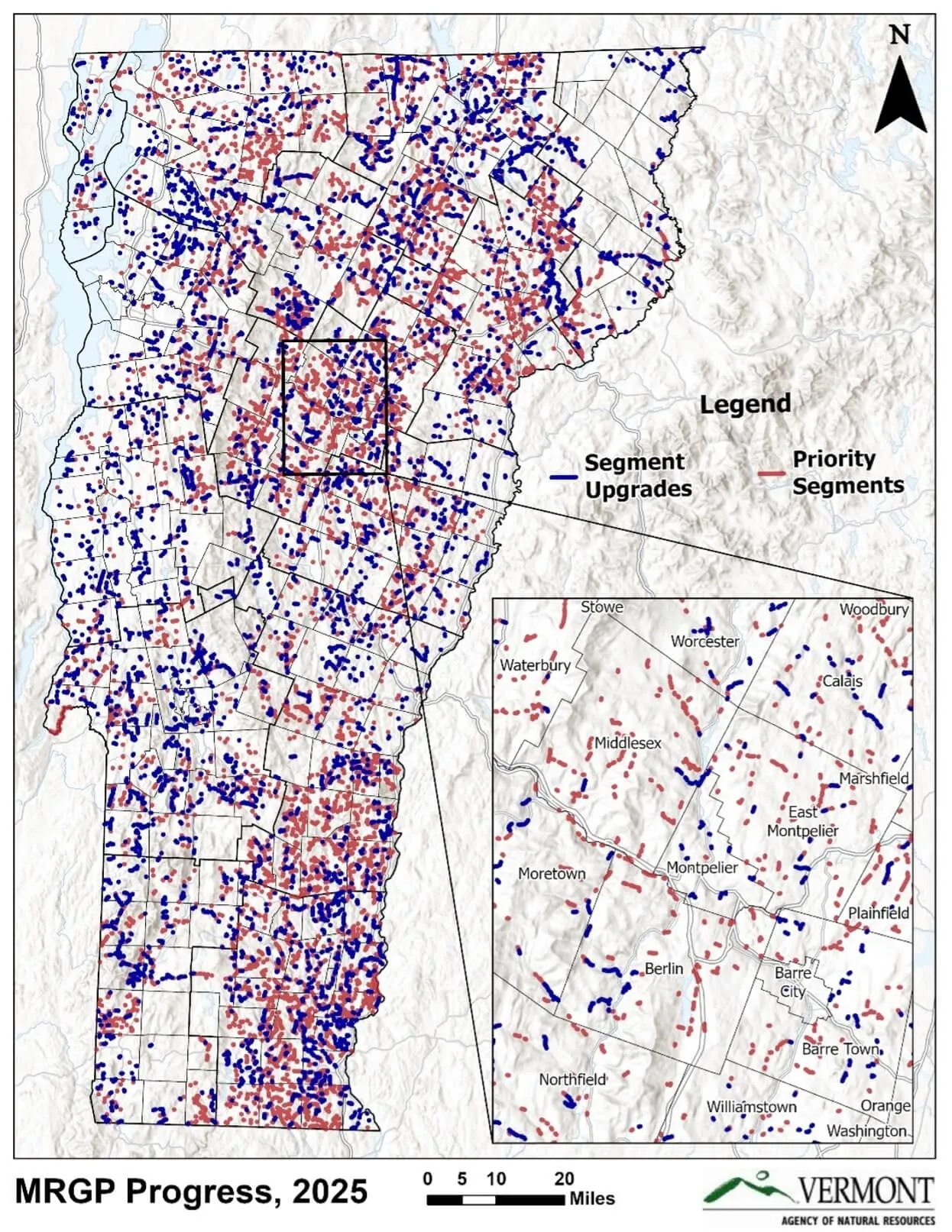 A map of Vermont showing town boundaries and road segments. Blue lines identify road segments upgraded to meet MRGP standards since 2017, and red segments require future upgrades to comply with the MRGP