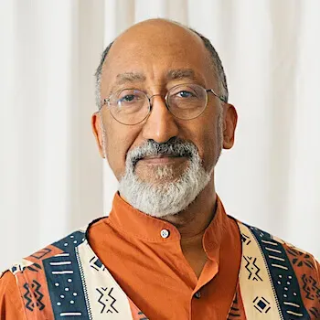 man wearing glasses and smiling