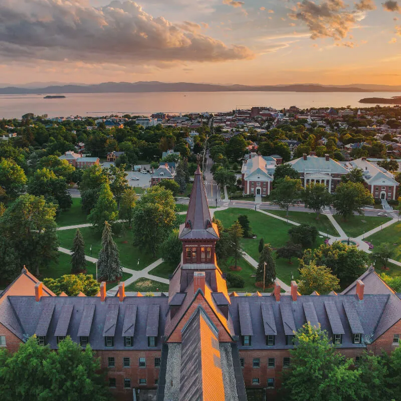 sunset view over a university campus look toward a lake and mountains