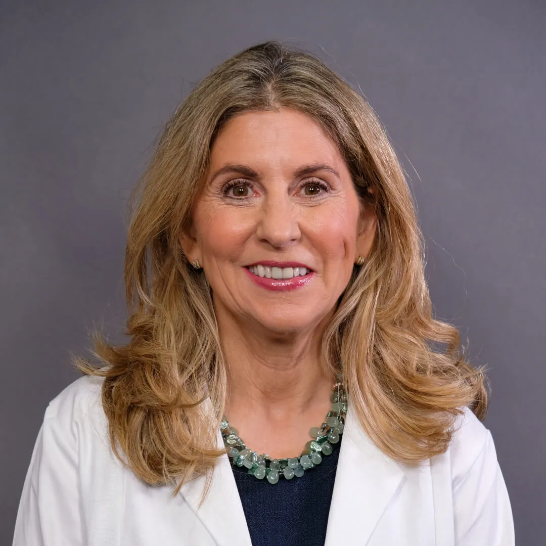 Woman in white coat